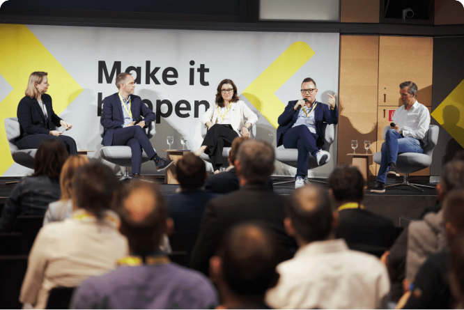 Panel of experts discussing business innovation and strategies, highlighting thought leadership and collaborative dialogue.